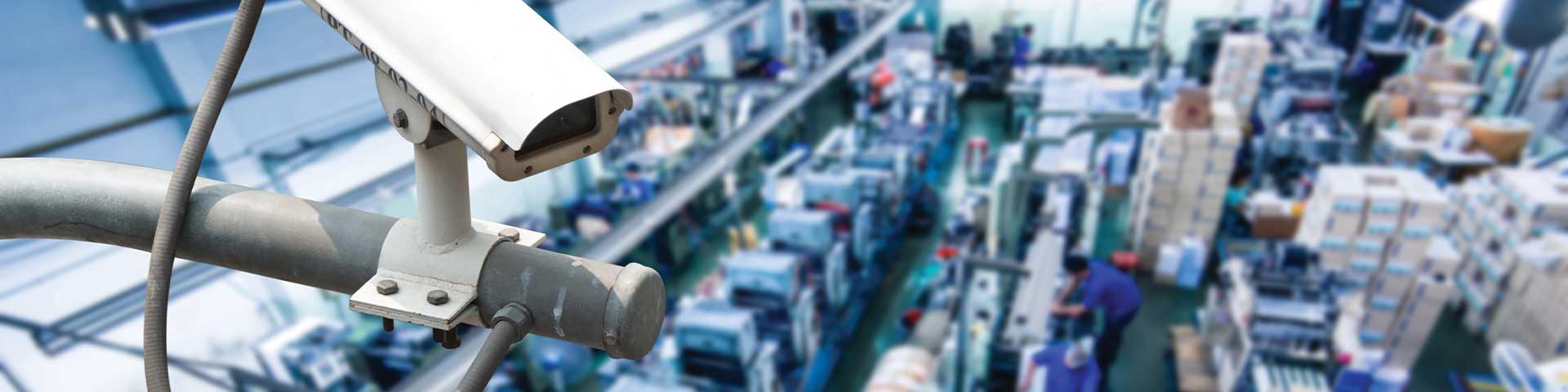 Surveillance camera overlooking a busy manufacturing facility.