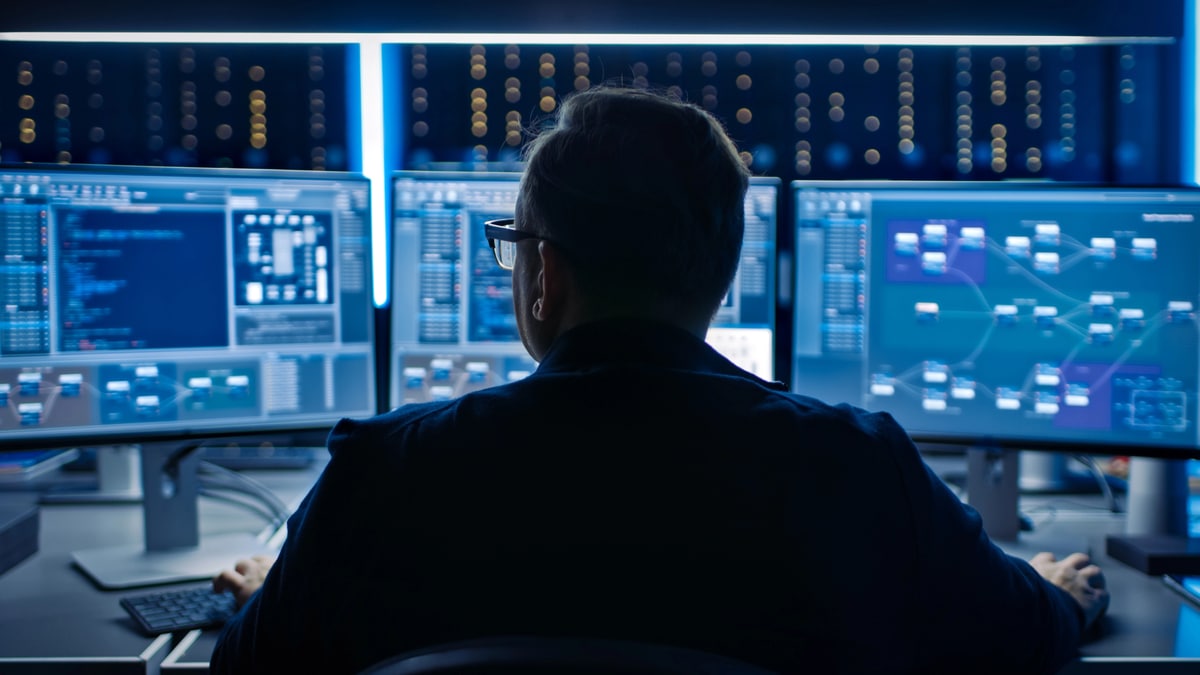 Preventive vs Reactive Security: Key Differences In the glow of multiple screens, a professional focuses on complex data analytics. This modern environment showcases the intricacies of digital information management.
